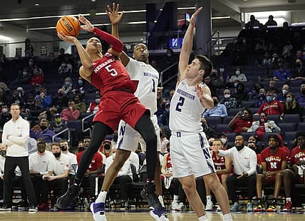 Feb 22, 2022; Evanston, Illinois, USA; Northwestern Wildcats guard Chase Audige (1) defends Nebraska Cornhuskers guard Bryce McGowens (5) during the second half at Welsh-Ryan Arena. Mandatory Credit: David Banks-USA TODAY Sports