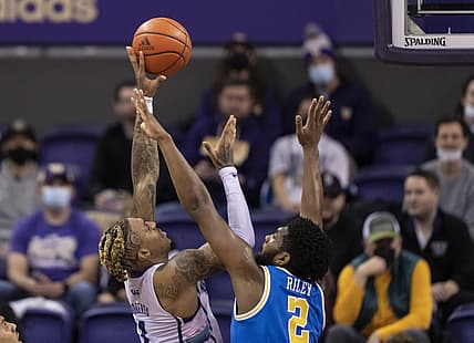 Feb 28, 2022; Seattle, Washington, USA; Washington forward Nate Roberts (1) shoots the ball over UCLA forward Cody Riley (2) during the first half at Alaska Airlines Arena at Hec Edmundson Pavilion. Mandatory Credit: Stephen Brashear-USA TODAY Sports
