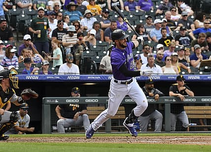 Jul 16, 2022; Denver, Colorado, USA; Colorado Rockies left fielder Kris Bryant (23) gets a base hit in the fifth inning against the Pittsburgh Pirates at Coors Field. Mandatory Credit: John Leyba-USA TODAY Sports