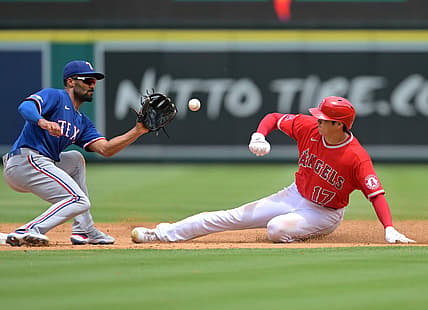 Jul 31, 2022; Anaheim, California, USA; Los Angeles Angels starting pitcher Shohei Ohtani (17) is caught stealing as he is tagged out by Texas Rangers second baseman Marcus Semien (2) in the third inning at Angel Stadium. Mandatory Credit: Jayne Kamin-Oncea-USA TODAY Sports