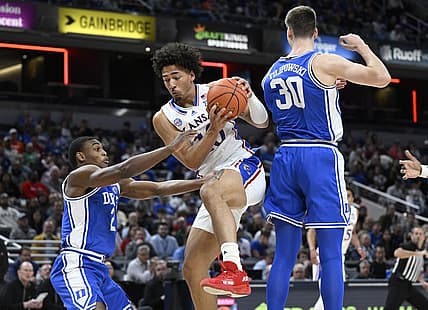 Nov 15, 2022; Indianapolis, Indiana, USA;  Kansas Jayhawks forward Jalen Wilson (10) grabs a rebound in front of Duke Blue Devils guard Jaylen Blakes (2) during the first half at Gainbridge Fieldhouse. Mandatory Credit: Marc Lebryk-USA TODAY Sports