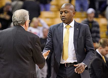Nov 23, 2022; Columbia, Missouri, USA; Coastal Carolina Chanticleers head coach Cliff Ellis, left, shakes hands with Missouri Tigers head coach Dennis Gates after a game at Mizzou Arena. Mandatory Credit: Denny Medley-USA TODAY Sports