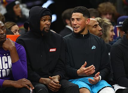 Feb 24, 2023; Phoenix, Arizona, USA; Phoenix Suns forward Kevin Durant (left) and guard Devin Booker against the Oklahoma City Thunder in the second half at Footprint Center. Mandatory Credit: Mark J. Rebilas-USA TODAY Sports