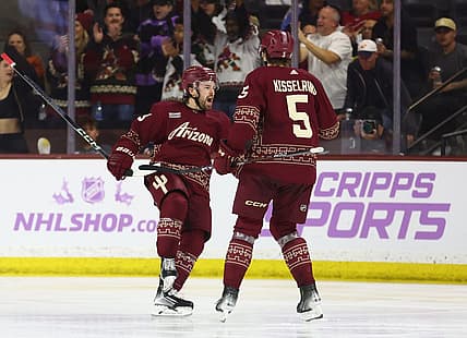 Nov 30, 2023; Tempe, Arizona, USA; Arizona Coyotes left wing Michael Carcone (53) celebrates with defenseman Michael Kesselring (5) after scoring a goal against the Colorado Avalanche in the third period at Mullett Arena. Mandatory Credit: Mark J. Rebilas-USA TODAY Sports