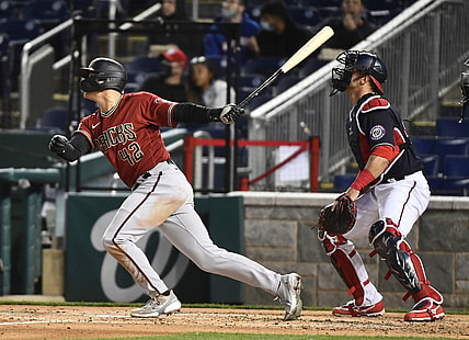 Apr 15, 2021; Washington, District of Columbia, USA; Arizona Diamondbacks second baseman Andrew Young hits a grand slam against the Washington Nationals during the second inning at Nationals Park. Mandatory Credit: Brad Mills-USA TODAY Sports