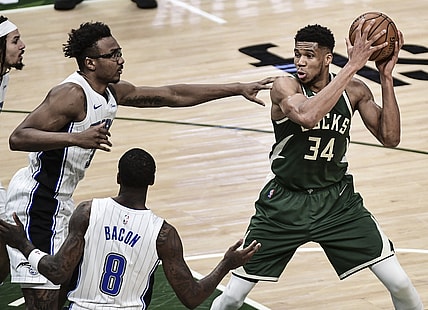 May 11, 2021; Milwaukee, Wisconsin, USA; Milwaukee Bucks forward Giannis Antetokounmpo (34) controls the ball against Orlando Magic center Wendell Carter Jr. (34) during the second quarter at Fiserv Forum. Mandatory Credit: Benny Sieu-USA TODAY Sports
