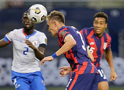 Jul 11, 2021; Kansas City, Kansas, USA; United States defender Sam Vines (3) scores a goal as Haiti defender Carlens Arcus (2) defends in the first half during a CONCACAF Gold Cup group stage soccer match at Children's Mercy Park. Mandatory Credit: Jay Biggerstaff-USA TODAY Sports