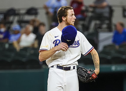 Aug 30, 2021; Arlington, Texas, USA;  Texas Rangers starting pitcher A.J. Alexy (62) throws reacts during the third inning against the Colorado Rockies at Globe Life Field. Mandatory Credit: Kevin Jairaj-USA TODAY Sports