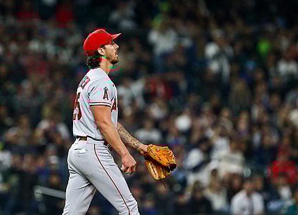 Jun 17, 2022; Seattle, Washington, USA; Los Angeles Angels starting pitcher Michael Lorenzen (25) reacts after walking in a run against the Seattle Mariners during the fourth inning at T-Mobile Park. Mandatory Credit: Lindsey Wasson-USA TODAY Sports