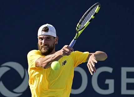 Aug 10, 2022; Montreal, QC, Canada; Maxime Cressy (USA) hits a forehand against Gael Monfils (FRA) (not pictured) in second round play at IGA Stadium. Mandatory Credit: Eric Bolte-USA TODAY Sports
