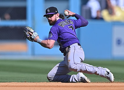 Oct 2, 2022; Los Angeles, California, USA; Colorado Rockies second baseman Brendan Rodgers (7) makes a play to throw out Los Angeles Dodgers first baseman Freddie Freeman (5) at second base in the sixth inning at Dodger Stadium. Mandatory Credit: Jayne Kamin-Oncea-USA TODAY Sports