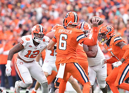 Sep 30, 2023; Syracuse, New York, USA; Clemson Tigers defensive end T.J. Parker (12) rushes Syracuse Orange quarterback Garrett Shrader (6) in the first quarter at the JMA Wireless Dome. Mandatory Credit: Mark Konezny-USA TODAY Sports