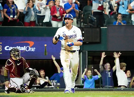 Texas Rangers Corey Seager (5) hits a two-run home run off Arizona Diamondbacks relief pitcher Paul Sewald (38) in the ninth inning during Game 1 of the 2023 World Series at Globe Life Field on Oct 27, 2023.