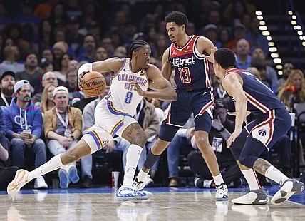Feb 23, 2024; Oklahoma City, Oklahoma, USA; Oklahoma City Thunder forward Jalen Williams (8) drives to the basket against Washington Wizards guard Jordan Poole (13) during the second quarter at Paycom Center. Mandatory Credit: Alonzo Adams-USA TODAY Sports