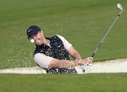 Nov 15, 2020; Augusta, Georgia, USA; Rory McIlroy plays a shot from a bunker on the second hole during the final round of The Masters golf tournament at Augusta National GC. Mandatory Credit: Michael Madrid-USA TODAY Sports