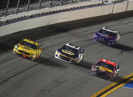 Feb 14, 2021; Daytona Beach, Florida, USA; NASCAR Cup Series driver Michael McDowell (34) leads NASCAR Cup Series driver Chase Elliott (9) and Austin Dillon (3) to win the during the Daytona 500 at Daytona International Speedway. Mandatory Credit: Mark J. Rebilas-USA TODAY Sports