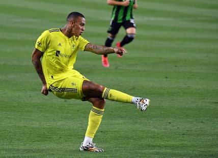 May 23, 2021; Nashville, TN, USA; Nashville SC forward Jhonder Cadiz (99) assists on a goal during the first half against the Austin FC at Nissan Stadium. Mandatory Credit: Christopher Hanewinckel-USA TODAY Sports