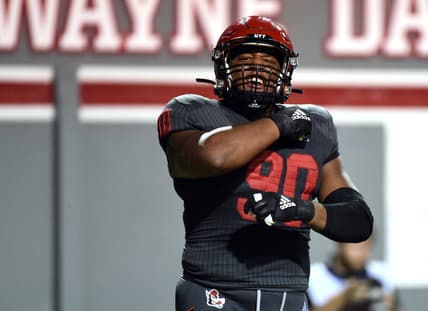 Sep 2, 2021; Raleigh, North Carolina, USA; North Carolina State Wolfpack defensive end Savion Jackson (90) reacts after a tackle against the South Florida Bulls during the second half at Carter-Finley Stadium. Mandatory Credit: Rob Kinnan-USA TODAY Sports