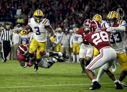 Nov 6, 2021; Tuscaloosa, Alabama, USA; LSU Tigers running back Tyrion Davis-Price (3) is tackled for a loss by Alabama Crimson Tide linebacker Christian Harris (8) during the second half at Bryant-Denny Stadium. Mandatory Credit: Butch Dill-USA TODAY Sports