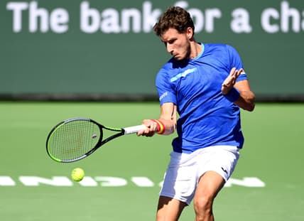 Oct 12, 2021; Indian Wells, CA, USA; Pablo Carreno Busta (ESP) hits a shot against Karen Khachanov (RUS) during a fourth round match in the BNP Paribas Open at the Indian Wells Tennis Garden. Mandatory Credit: Jayne Kamin-Oncea-USA TODAY Sports