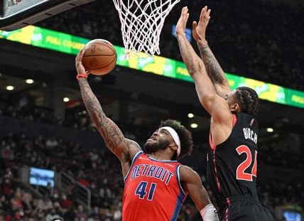 Mar 3, 2022; Toronto, Ontario, CAN;  Detroit Pistons forward Saddiq Bey (41) shoots for a basket past Toronto Raptors center Kham Birch (24) in the first half at Scotiabank Arena. Mandatory Credit: Dan Hamilton-USA TODAY Sports