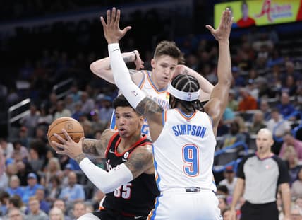 Apr 5, 2022; Oklahoma City, Oklahoma, USA; Portland Trail Blazers forward Didi Louzada (35) dribbles the ball between Oklahoma City Thunder guard Vit Krejci (27) and guard Zavier Simpson (9) during the second quarter at Paycom Center. Mandatory Credit: Alonzo Adams-USA TODAY Sports