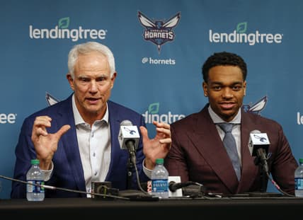 Jun 21, 2019; Charlotte, NC, USA; Charlotte Hornets president of basketball operations Mitch Kupchak, left, talks about 2019 NBA draft pick PJ Washington, right, during a press conference at Spectrum Center. Mandatory Credit: Nell Redmond-USA TODAY Sports