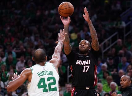 May 21, 2022; Boston, Massachusetts, USA; Miami Heat forward P.J. Tucker (17) shoots the ball against Boston Celtics center Al Horford (42) in the second quarter during game three of the 2022 eastern conference finals at TD Garden. Mandatory Credit: David Butler II-USA TODAY Sports