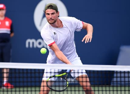 Aug 7, 2021; Toronto, Ontario, Canada; Maxime Cressy of the United States plays a shot against Feliciano Lopez of Spain in first round qualifying play for the National Bank Open at the Aviva Centre. Mandatory Credit: Dan Hamilton-USA TODAY Sports