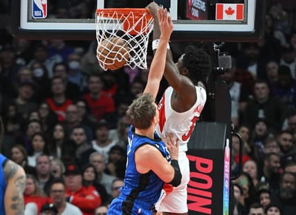 Dec 3, 2022; Toronto, Ontario, CAN;   Toronto Raptors forward OG Anunoby (3) dunks for a basket over Orlando Magic forward Franz Wagner (22) in the first half at Scotiabank Arena. Mandatory Credit: Dan Hamilton-USA TODAY Sports