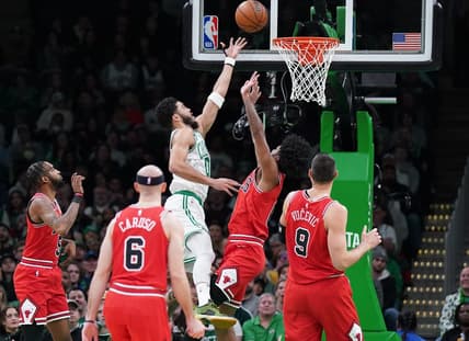 Jan 9, 2023; Boston, Massachusetts, USA; Boston Celtics forward Jayson Tatum (0) shoots against Chicago Bulls guard Coby White (0) in the first quarter at TD Garden. Mandatory Credit: David Butler II-USA TODAY Sports