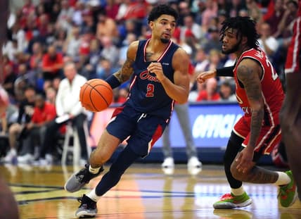 Jan 28, 2023; Boca Raton, Florida, USA; Florida Atlantic Owls guard Nicholas Boyd (2) drives toward the basket as Western Kentucky Hilltoppers guard Dayvion McKnight (20) defends during the first half at Eleanor R. Baldwin Arena. Mandatory Credit: Jim Rassol-USA TODAY Sports