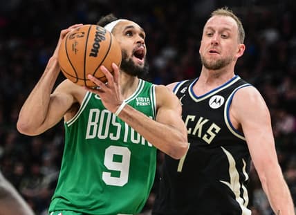 Feb 14, 2023; Milwaukee, Wisconsin, USA;  Boston Celtics guard Derrick White (9) looks for a shot against Milwaukee Bucks forward Joe Ingles (7) in the fourth quarter at Fiserv Forum. Mandatory Credit: Benny Sieu-USA TODAY Sports