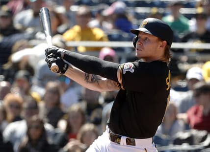 Apr 9, 2023; Pittsburgh, Pennsylvania, USA;  Pittsburgh Pirates center fielder Jack Suwinski (65) hits a sacrifice fly RBI against the Chicago White Sox during the second inning at PNC Park. Mandatory Credit: Charles LeClaire-USA TODAY Sports
