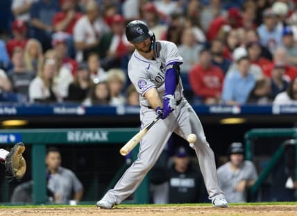 Apr 20, 2023; Philadelphia, Pennsylvania, USA; Colorado Rockies first baseman C.J. Cron (25) hits a single during the sixth inning against the Philadelphia Phillies at Citizens Bank Park. Mandatory Credit: Bill Streicher-USA TODAY Sports