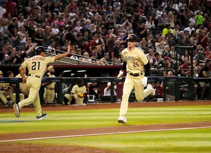 Jun 16, 2023; Phoenix, AZ, USA;  Arizona Diamondbacks designated hitter Pavin Smith (26) scores on a Corbin Carroll RBI-double against the Cleveland Guardians in the sixth inning at Chase Field. Mandatory Credit: Rob Schumacher-Arizona Republic