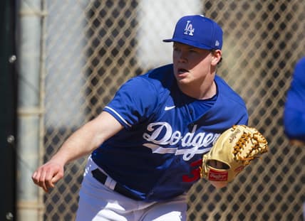 Feb 23, 2021; Glendale, Arizona, USA; Los Angeles Dodgers pitcher Gus Varland throws during Spring Training workouts at Camelback Ranch. Mandatory Credit: Mark J. Rebilas-USA TODAY Sports