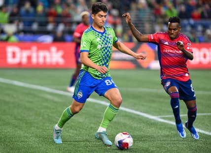 Nov 10, 2023; Seattle, Washington, USA; Seattle Sounders midfielder Josh Atencio (84) dribbles the ball as FC Dallas forward J  der Obrian (8) defends during the first half at Lumen Field. Mandatory Credit: Steven Bisig-USA TODAY Sports