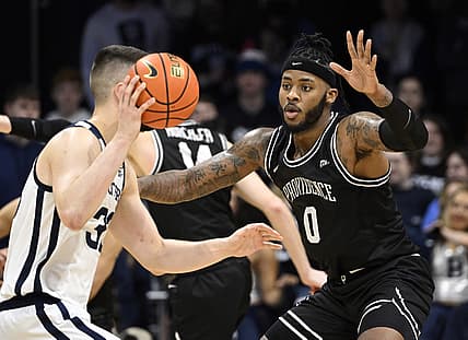 Feb 20, 2022; Indianapolis, Indiana, USA; Providence Friars center Nate Watson (0) defends against Butler Bulldogs forward Bryce Golden (33) during the second half at Hinkle Fieldhouse. Friars won 71-70. Mandatory Credit: Marc Lebryk-USA TODAY Sports