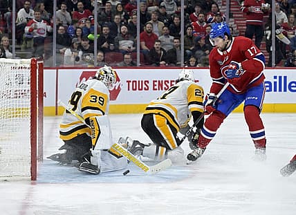 Dec 13, 2023; Montreal, Quebec, CAN; Pittsburgh Penguins Alex Nedeljkovic (39) stops Montreal Canadiens forward Josh Anderson (17) during the second period at the Bell Centre. Mandatory Credit: Eric Bolte-USA TODAY Sports