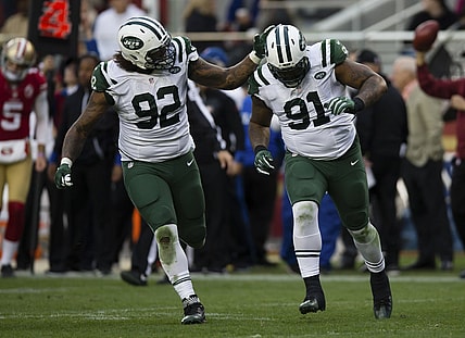 Jets Leonard Williams celebrates with defensive end Sheldon Richardson