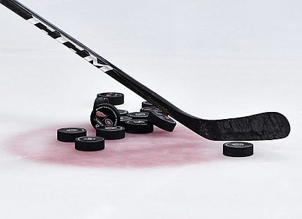Mar 12, 2019; Montreal, Quebec, CAN; Pucks  and a hockey stick during the warmup period before the game between the Montreal Canadiens and the Detroit Red Wings at the Bell Centre. Mandatory Credit: Eric Bolte-USA TODAY Sports