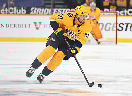 Apr 1, 2021; Nashville, Tennessee, USA; Nashville Predators defenseman Roman Josi (59) skates with the puck during the first period against the Dallas Stars at Bridgestone Arena. Mandatory Credit: Christopher Hanewinckel-USA TODAY Sports