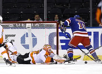 Apr 22, 2021; New York, New York, USA; Artemi Panarin #10 of the New York Rangers heads for the net as Brian Elliott #37 of the Philadelphia Flyers defends in the first period  at Madison Square Garden. Mandatory Credit:  Elsa/POOL PHOTOS-USA TODAY Sports