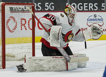 Apr 22, 2021; Vancouver, British Columbia, CAN; Ottawa Senators goalie Matt Murray (30) makes a save against the Vancouver Canucks  in the third period at Rogers Arena. Senators won 3-0.  Mandatory Credit: Bob Frid-USA TODAY Sports
