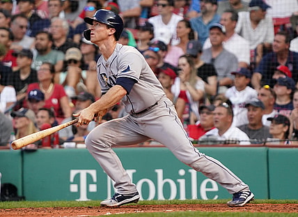 Aug 12, 2021; Boston, Massachusetts, USA; Tampa Bay Rays third baseman Joey Wendle (18) hits a triple against the Boston Red Sox during the eighth inning at Fenway Park. Mandatory Credit: David Butler II-USA TODAY Sports
