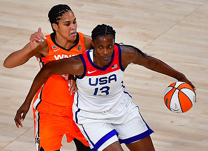 Jul 14, 2021; Las Vegas, NV, USA; Team USA center Sylvia Fowles (13) dribbles around WNBA All Star forward Brionna Jones (42) during the WNBA All Star Game at Michelob Ultra Arena at Mandalay Bay Resort. Mandatory Credit: Stephen R. Sylvanie-USA TODAY Sports