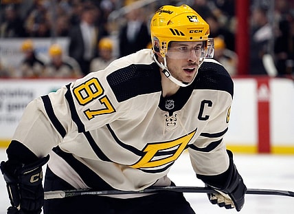 Jan 20, 2023; Pittsburgh, Pennsylvania, USA;  Pittsburgh Penguins center Sidney Crosby (87) prepares to take a face-off against the Ottawa Senators during the third period at PPG Paints Arena. Mandatory Credit: Charles LeClaire-USA TODAY Sports