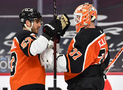 Feb 24, 2021; Philadelphia, Pennsylvania, USA; Philadelphia Flyers defenseman Shayne Gostisbehere (53) and Philadelphia Flyers goaltender Brian Elliott (37) celebrate the win against the New York Rangers at Wells Fargo Center. Mandatory Credit: Eric Hartline-USA TODAY Sports