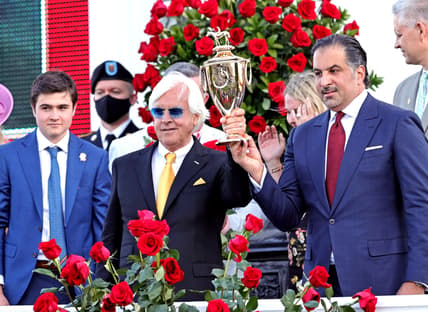 May 1, 2021; Louisville, Kentucky, USA; Medina Spirit owner Amr F. Zedan (right) and trainer Bob Baffert hold the trophy after winning the 147th running of the Kentucky Derby at Churchill Downs. Mandatory Credit: Jim Owens-USA TODAY Sports